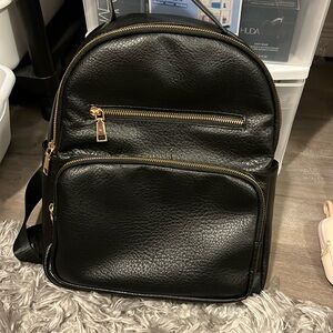 Backpack black with gold accents
